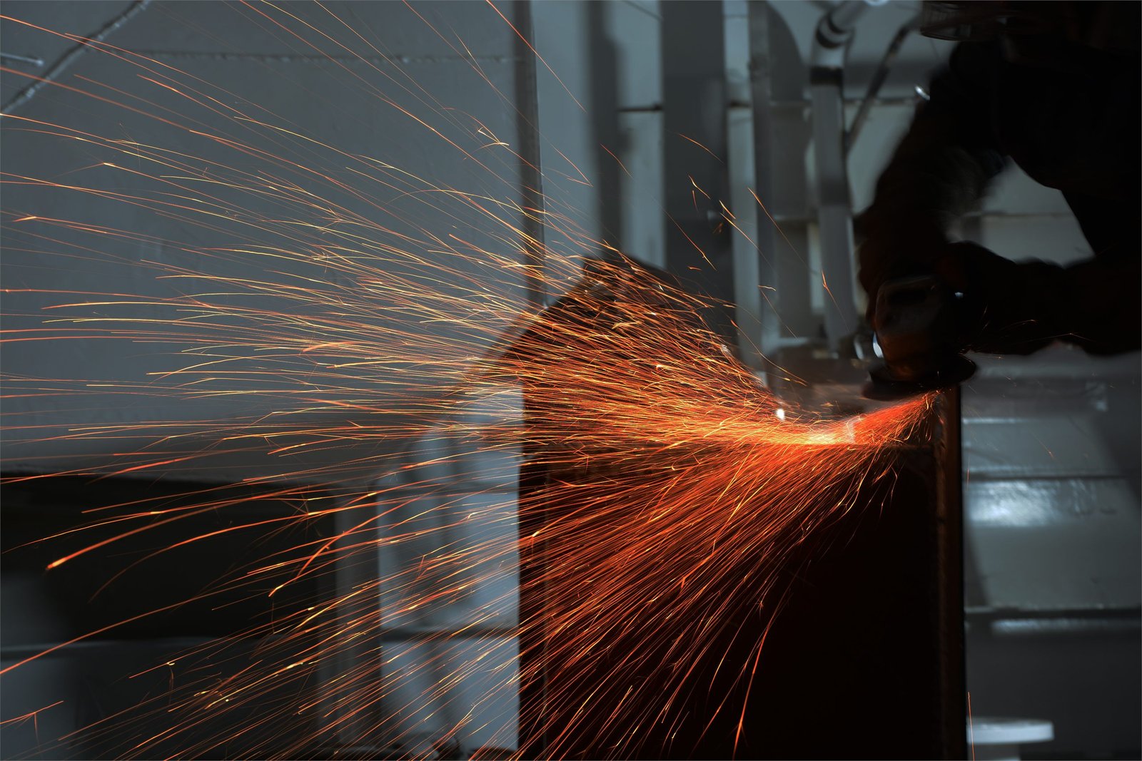 Grinding sparks against a hull in the yard