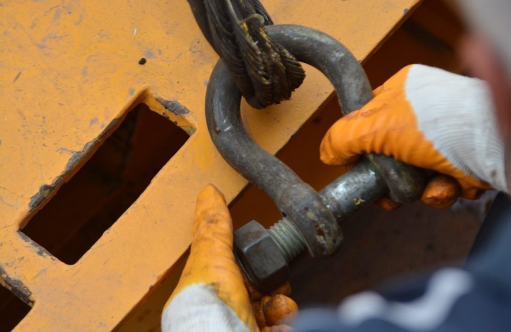Rigging and structure work aboard a sailing vessel in the yard