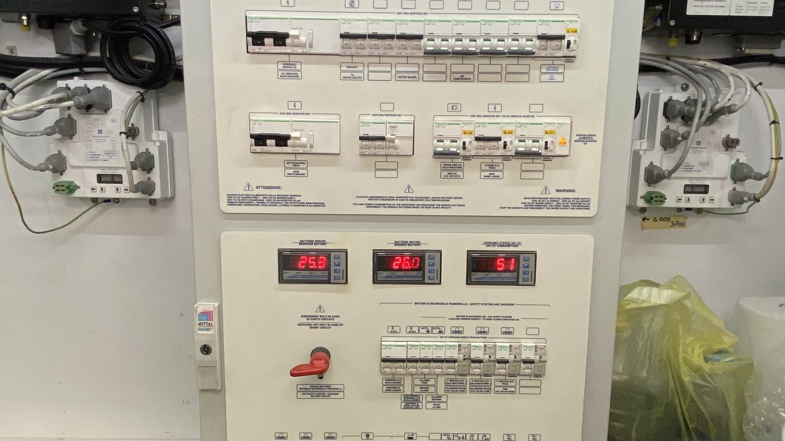 An as-found electrical panel whose twenty-four volt safety section carries breakers labelled smoke alarm, bilge alarm and three automatic bilge pumps, with two ways left blank